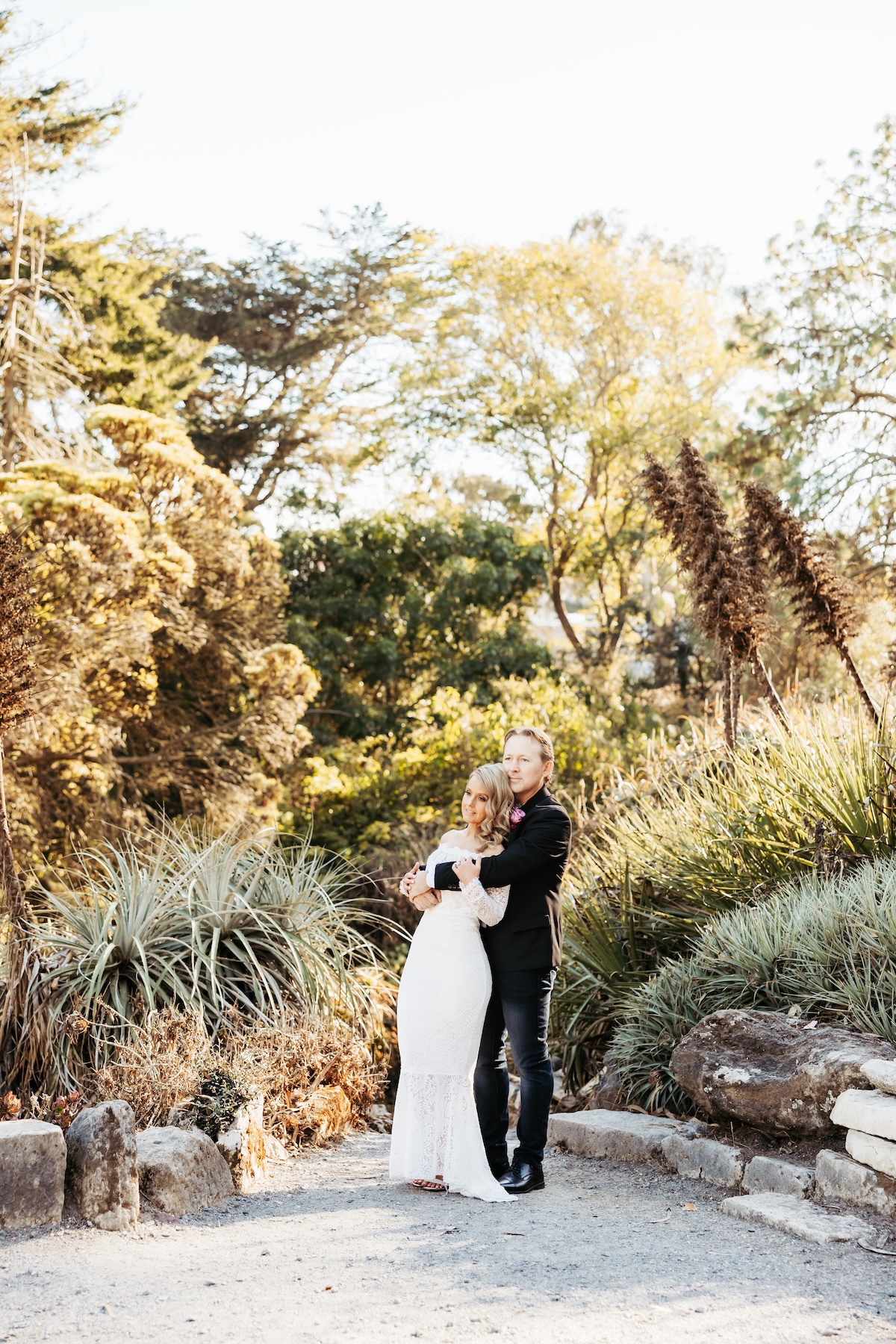 a couple's wedding portrait in the succulent garden of the San Francisco botanical garden.