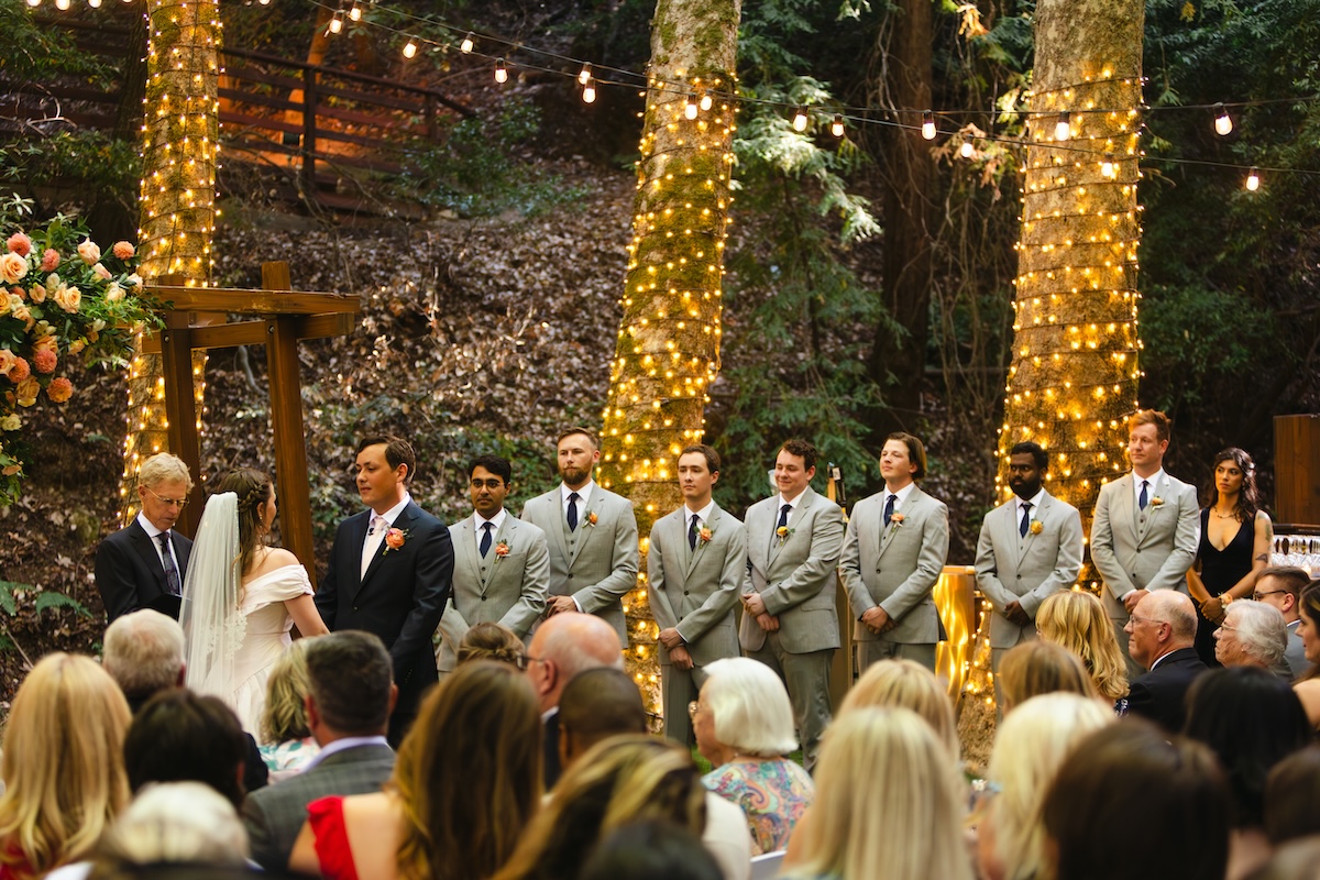 Wedding ceremony at Cathedral Grove, a forested event space at Saratoga Springs California.