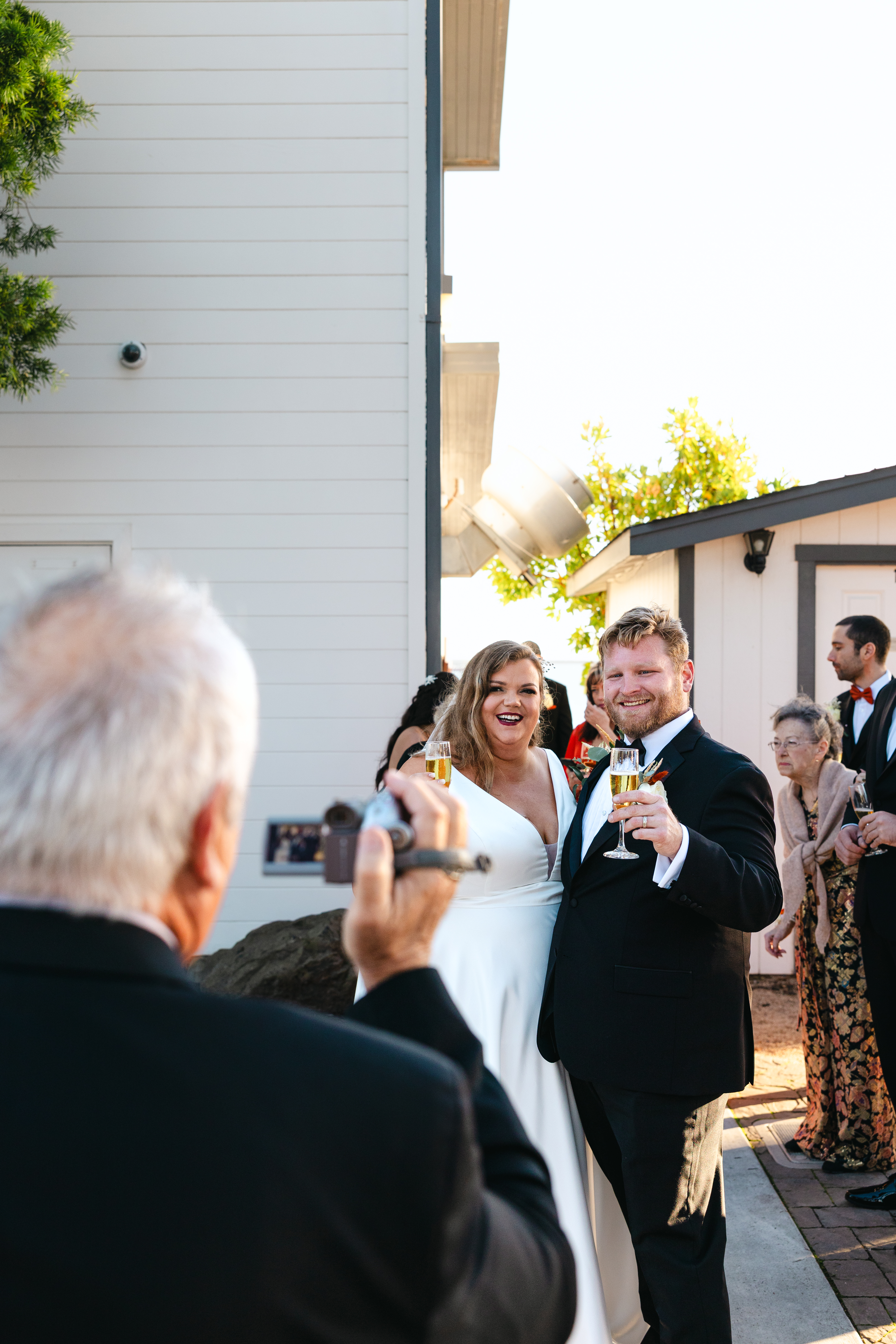 Grandpa captures video of the bride and groom just after the ceremony at Maverick's House in Half Moon Bay.